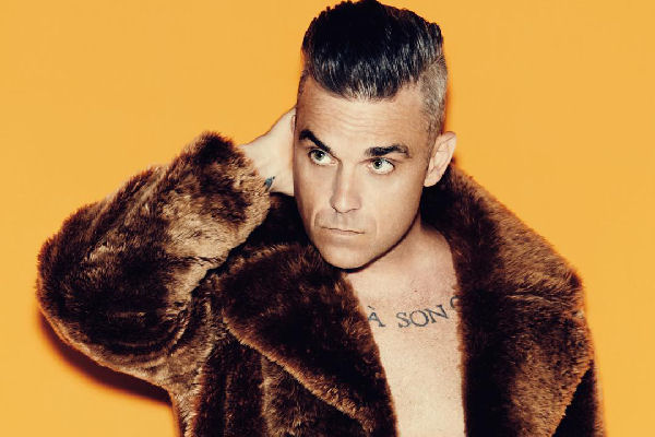Robbie Williams apunta al coronavirus en el single navideño “Can’t Stop Christmas”